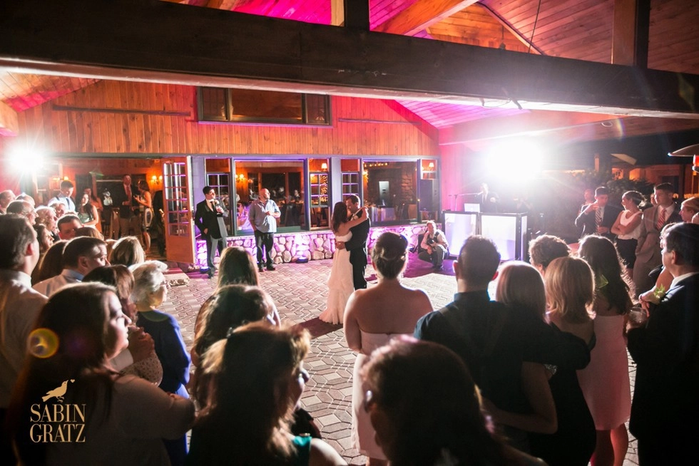 Bride and Groom share a dance at the Lake Placid Club Golf House.