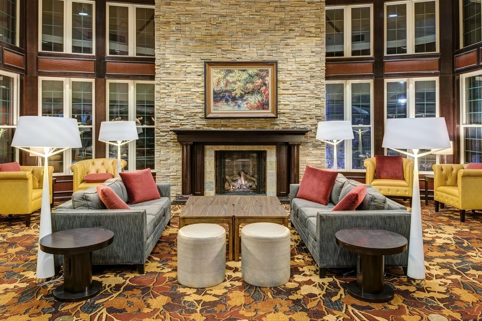 Lobby at Courtyard with couches and fireplace.