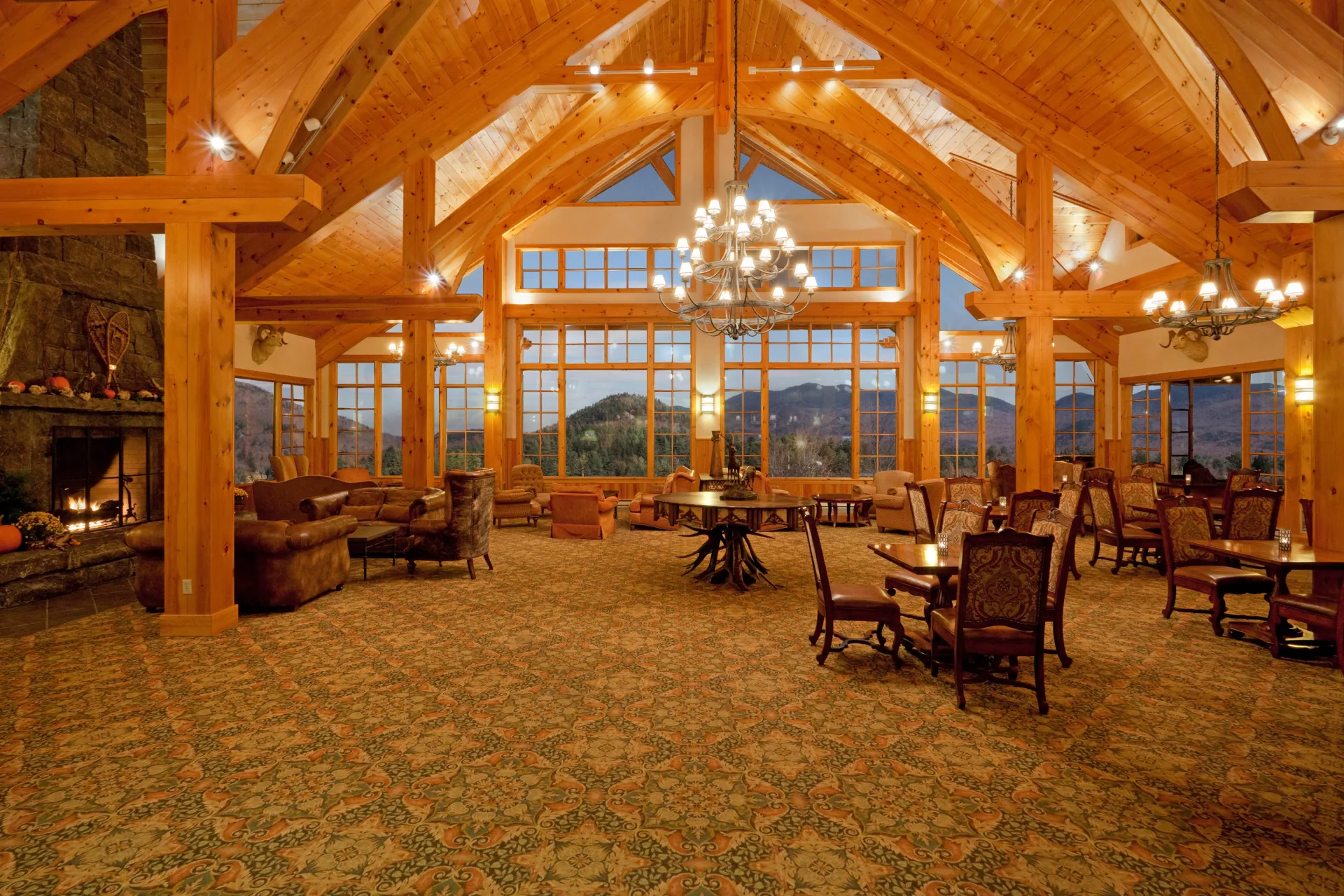 The Grand View ball room with expansive views of Mirror Lake and the surrounding mountains at Lake Placid Club Grandview