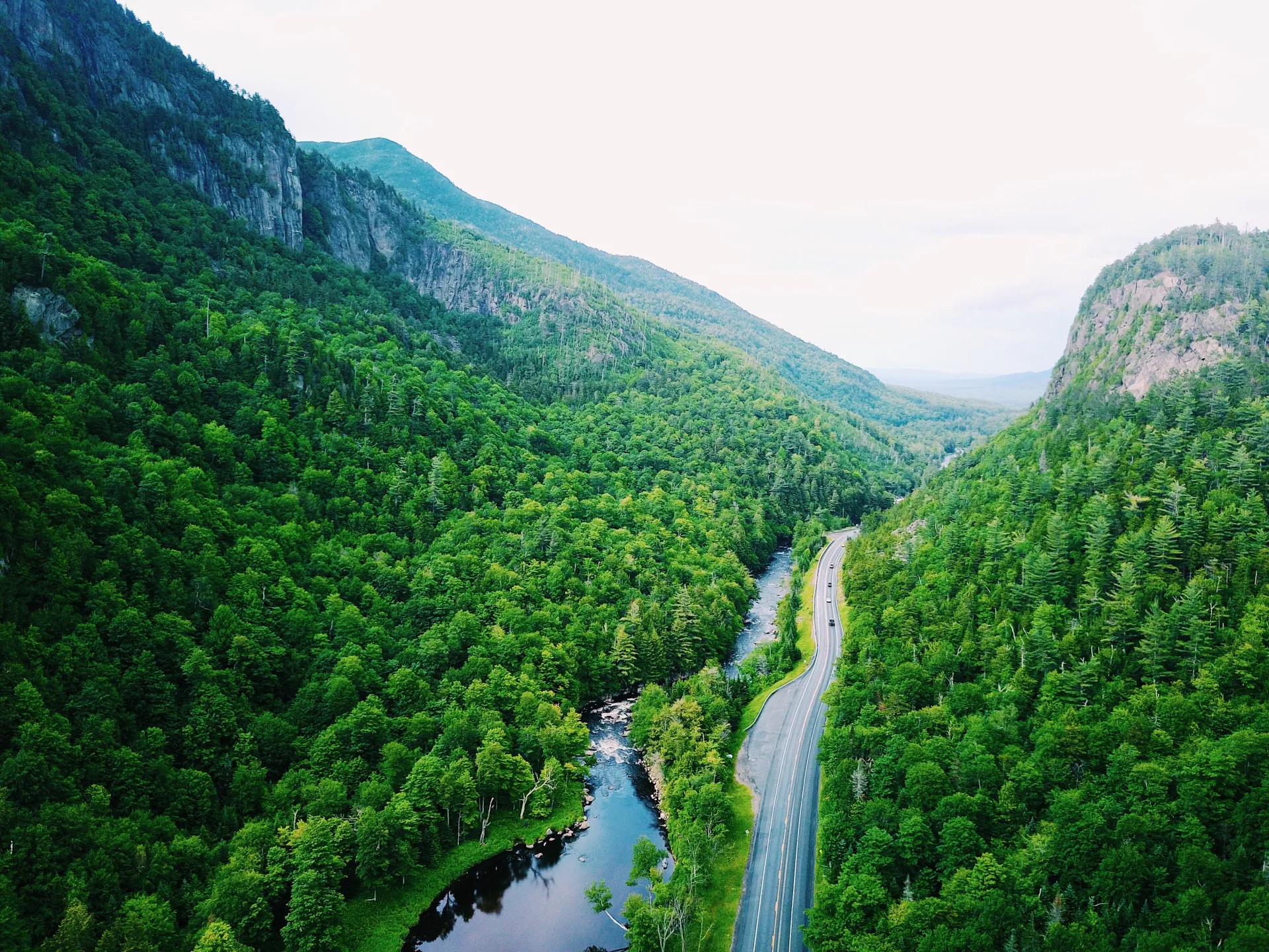 An aerial view of a road winding through a mountain pass.