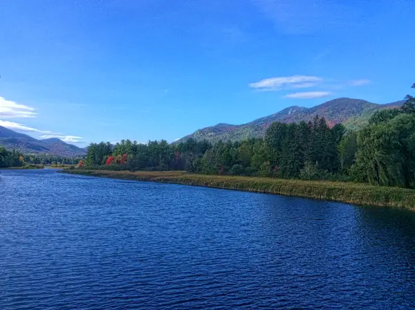 The blue of the sky matches the blue of the lake in the Adirondacks.
