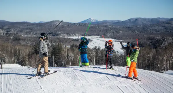 A few people at the top of Mt Pisgah ready to ski down