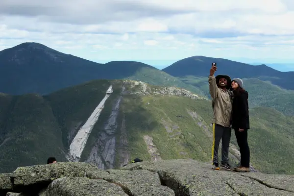 Two people taking a selfie on a mountain