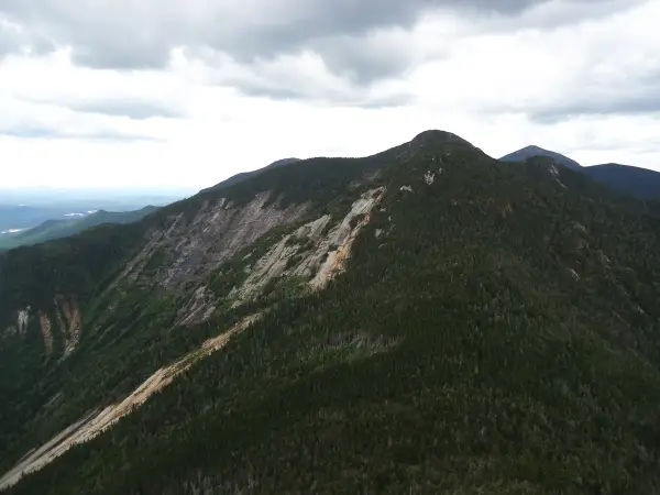 View of a tall mountain with rock slides