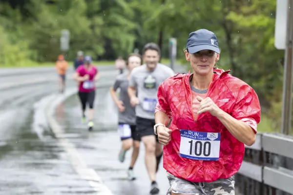 Racers run down wet road