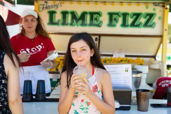 Child enjoys lemonade at the Lake Placid Horse Show