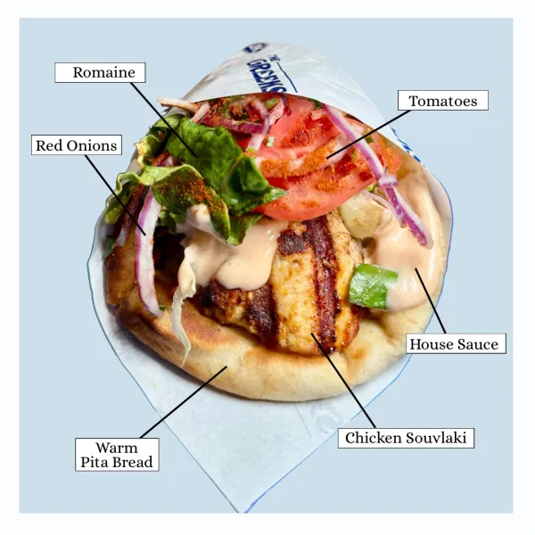Chicken Souvlaki with house sauce, tomatoes, romaine and red onion wrapped in warm pita bread