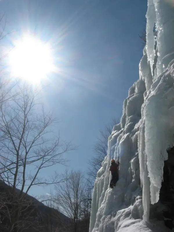 A wall of ice on rock in the sun
