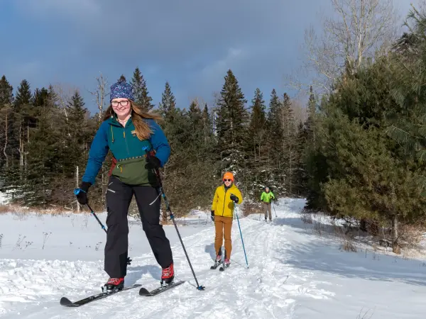 A few cross-country skiers on the trail