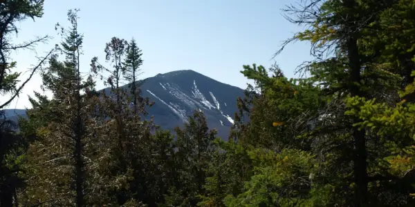 Dix Mountain can be seen from here, with the distinctive stripes of late fall ski trails.