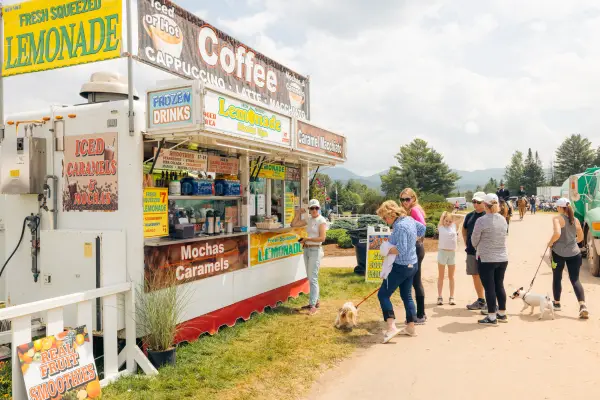 A beverage vendor at the horse show.