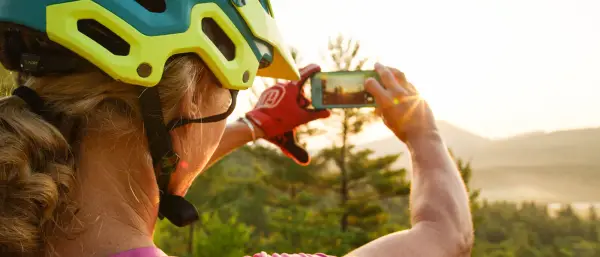 A mountain biker taking a photo