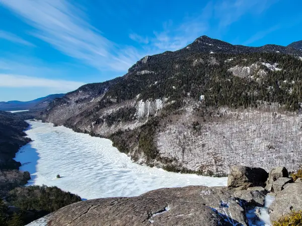 A frozen lake between two mountains