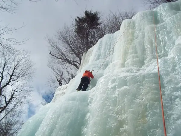 An ice climber on top rope