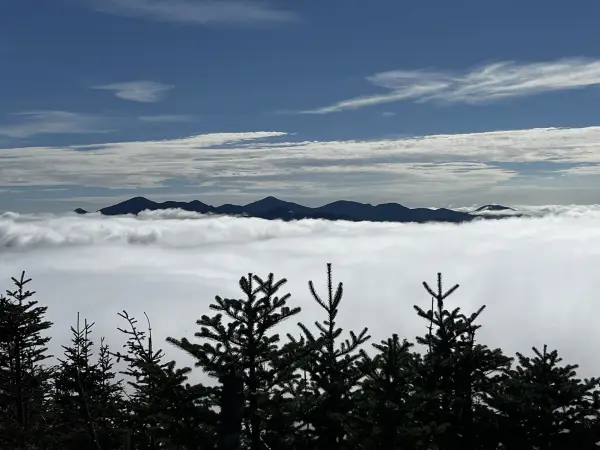 Mountains peek out from the clouds