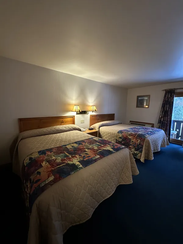 A two queen room with colorful quilts at Wildwood on the Lake.