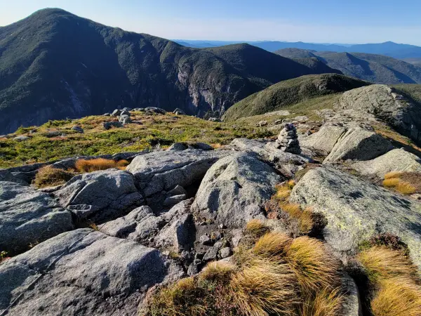 A view from a rocky summit into a deep gorge