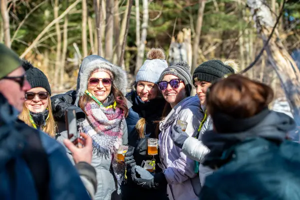 Group of skiers cheers on the trail. 