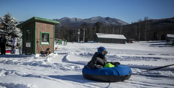 A tuber at the bottom of a run at Mt Pisgah