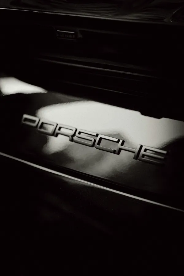 Close-up of Porche name on part of car exterior