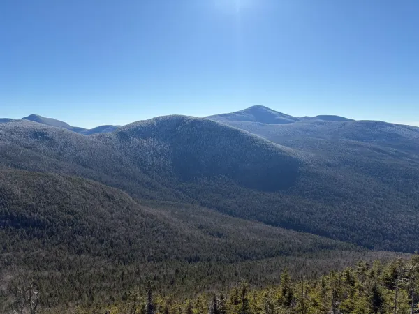 snow caresses the mountain tops