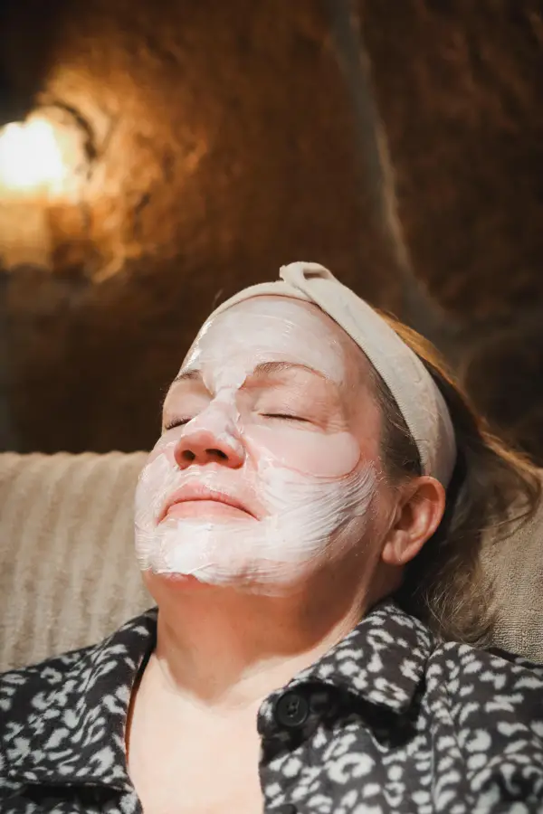A woman receives a rejuvenating facial 