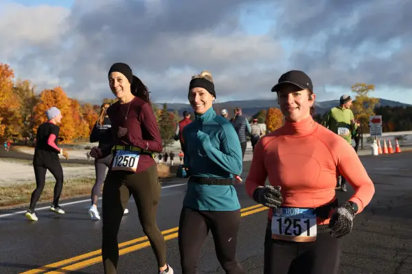 trio of athletes run together