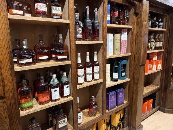 Wooden shelves full of wine and spirits