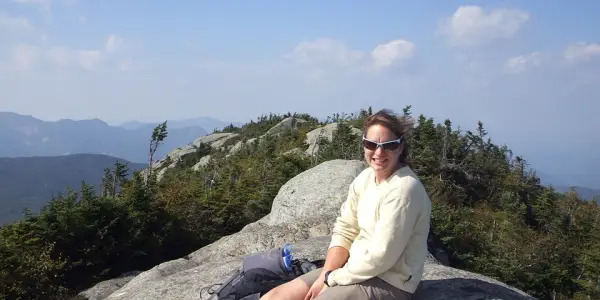 Celebrating the summit of Dix Mountain on a summer day.