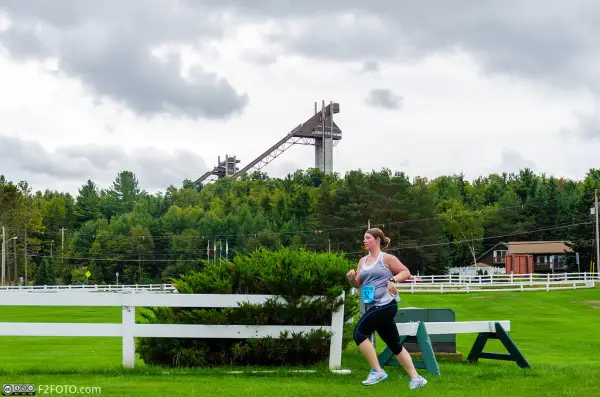 Runner with the ski jumps in the background