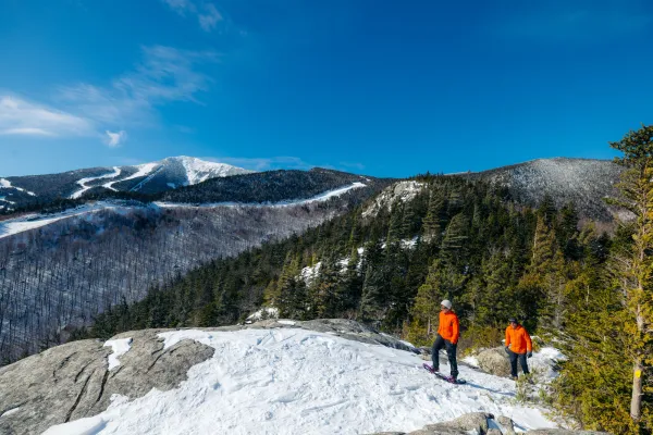 Two people on Bear Den in the winter