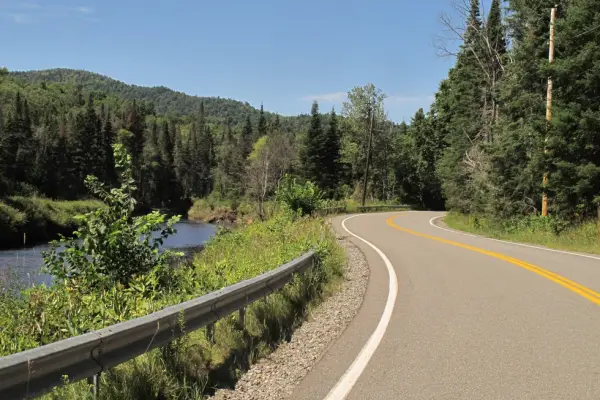 A winding road by a river
