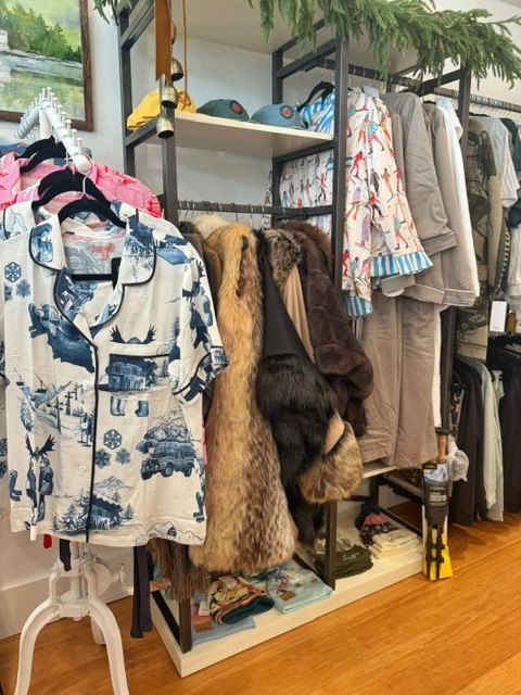 An assortment of clothing and home decor options at The Peak Boutique.
