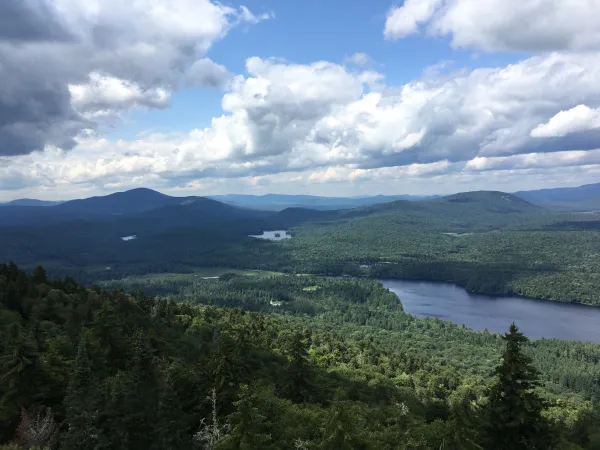 A lake surrounded by low mountains, seen from high above