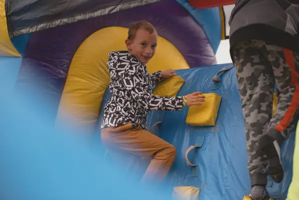 Child in a bounce house at Tupper Lake's fall festival
