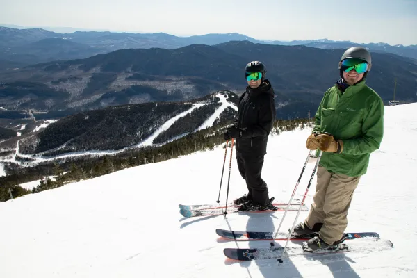 Two skiers await their run from the top of Whiteface Mountain.