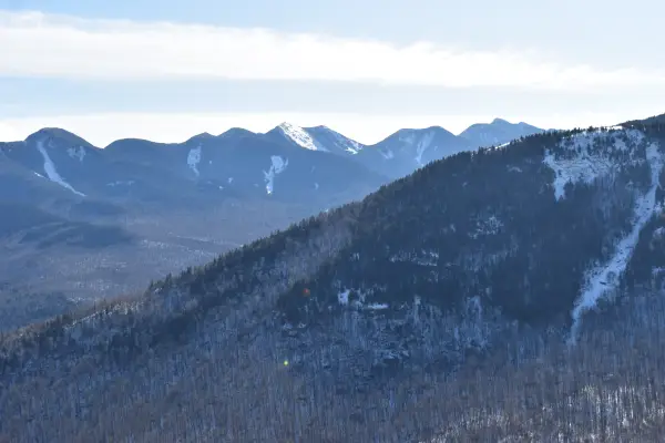 The view of mountains lightly covered in snow