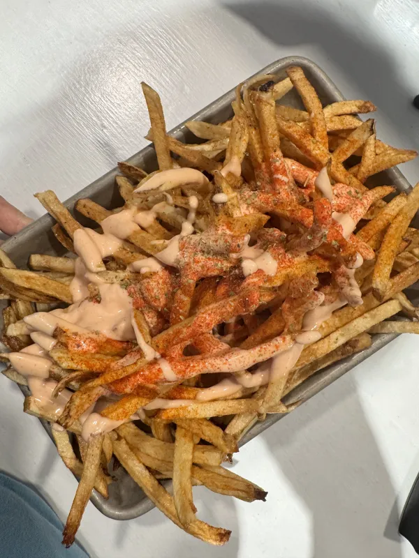 Hand-cut fries topped with House Sauce