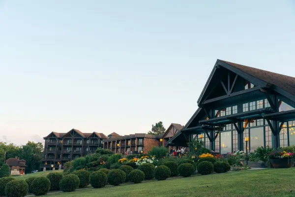 Exterior of Crowne Plaza great room and front patio seen from below in summer
