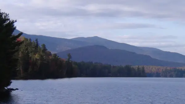 The scenery includes a mountain range.