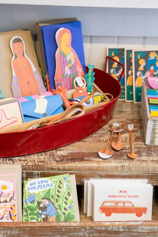 Greeting cards displayed on a shelf.