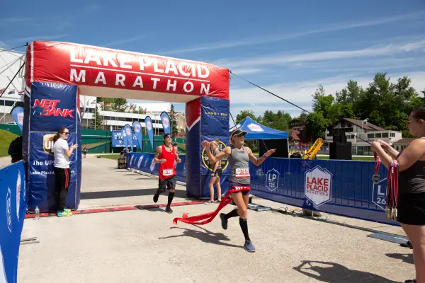 Runner crosses the finish line of the Lake Placid Marathon