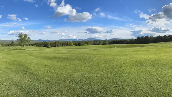 Mountain views from a lush and beautifully maintained fairway on at The Lake Placid Club.