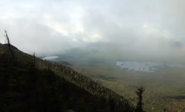 A view of a large lake from high up in the mountains