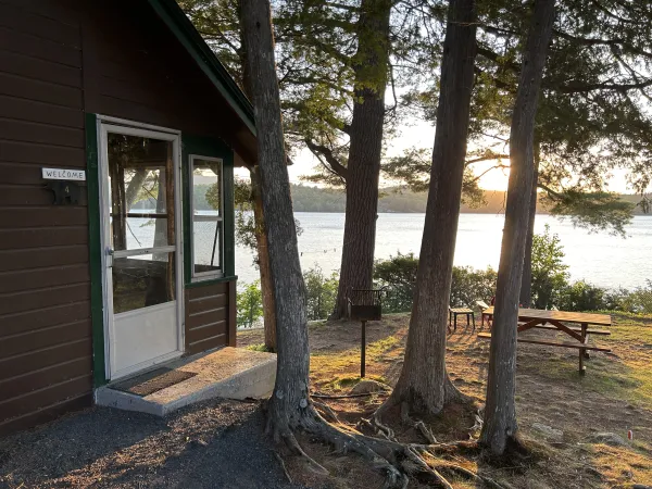 lakeside cabin view through the trees