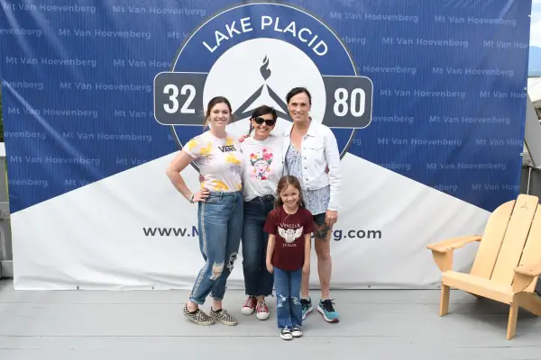 Family poses after finishing the bobsled experience