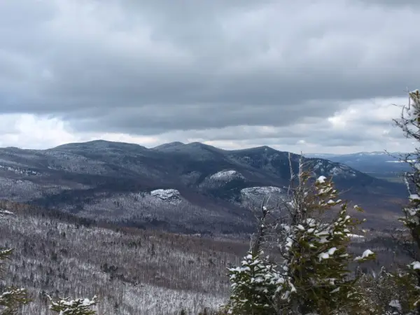 There are views from the wooded summit on Esther Mountain.