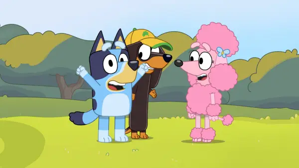 Shot from Bluey TV show featuring Bluey and two dog friends