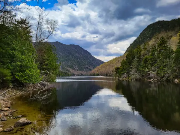 A lake reflecting mountains around it