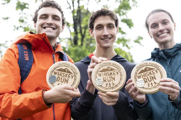 Whiskey Run winners hold up plaques